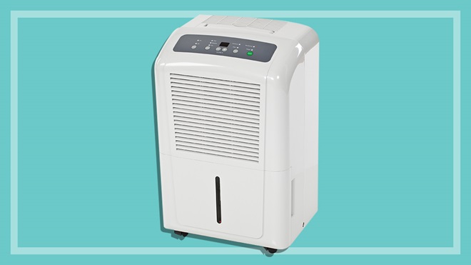 white dehumidifier on a teal background